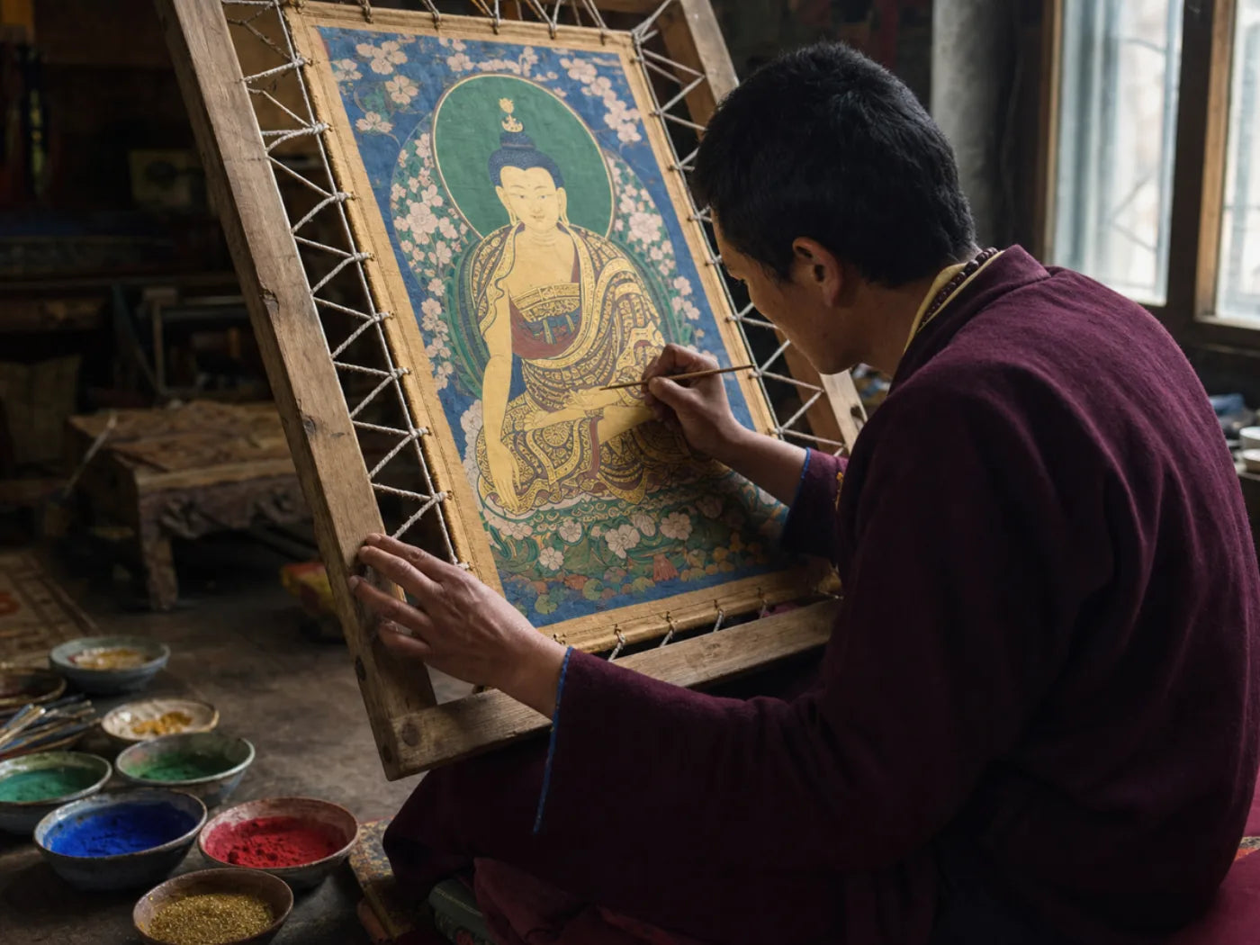 Illustrative reference of a painter working on a thangka